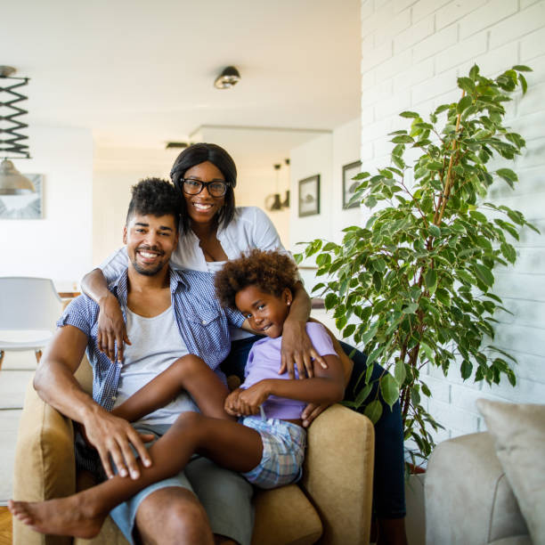 istock Happy parents with daughter at home 1064035946