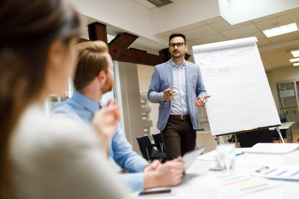 istock Businessman presenting new project to partners in the office 1064036098