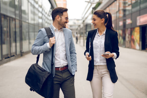 istock Two business people on their way to work 1064036702