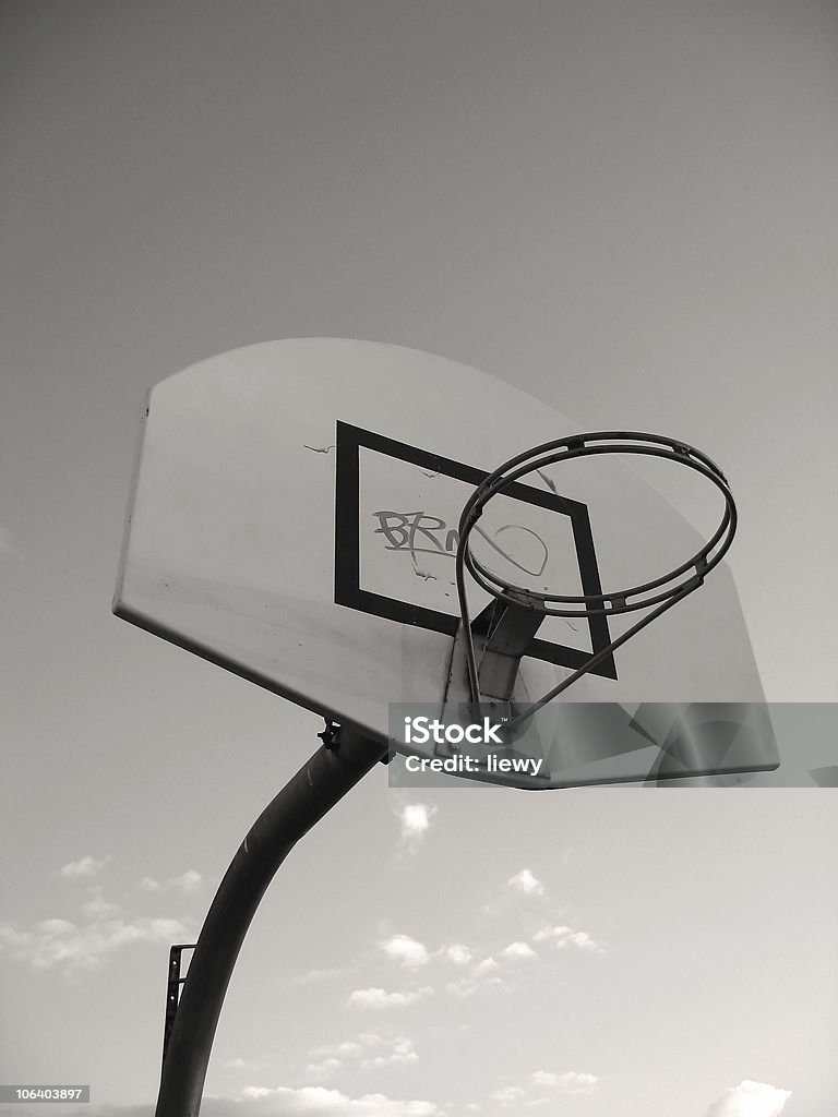 Basketball Hoop A basketball hoop without the basket netting. Graffiti was sprayed on the board. Focused at the ring. Basketball Hoop Stock Photo