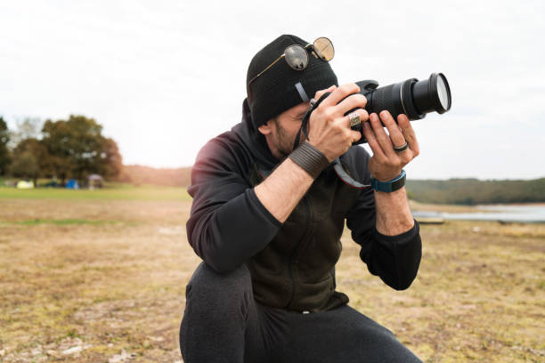 istock camping,lake,man,photographer 1064040664