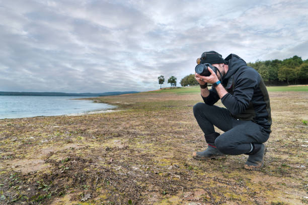 istock camping,lake,man,photographer 1064041540