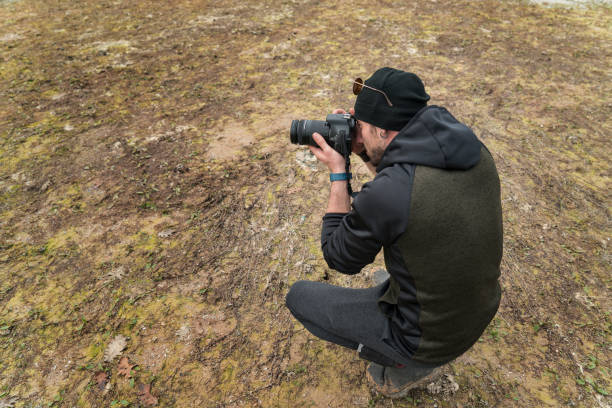 istock camping,lake,man,photographer 1064041562