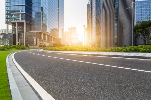 istock empty asphalt road front of modern buildings 1064045358
