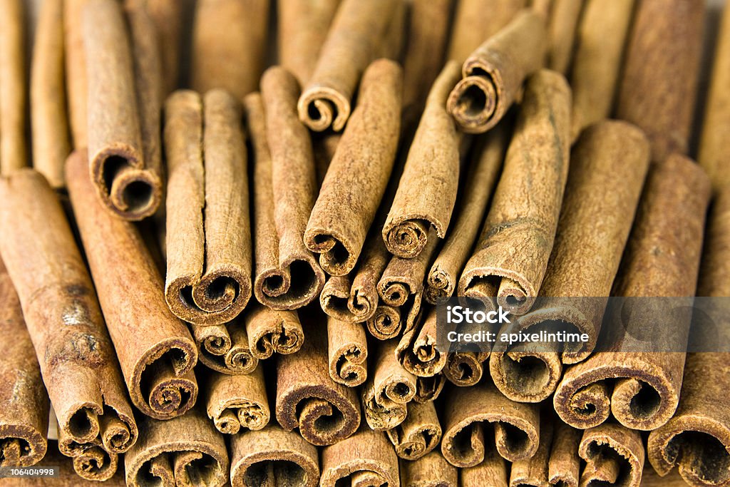 Cinnamon sticks A pile of cinnamon sticks. This is a spice used on many world cuisine.  Shallow DOF Brown Stock Photo