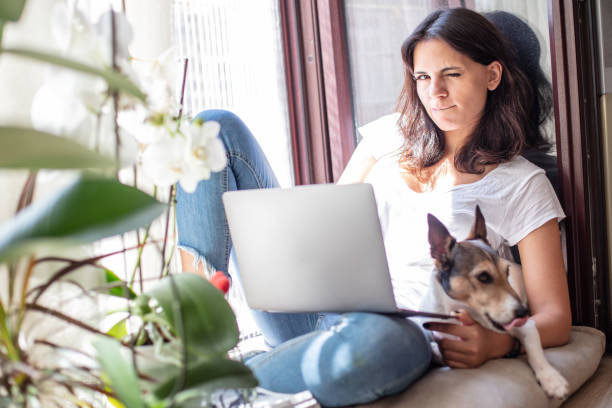 istock Pretty young woman relaxing on a window seat 1064050014
