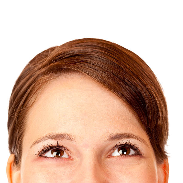 Close-up of happy beautiful womans head looking up stock photo