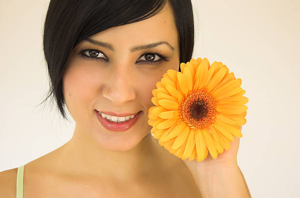 istock young woman with flower 106405614