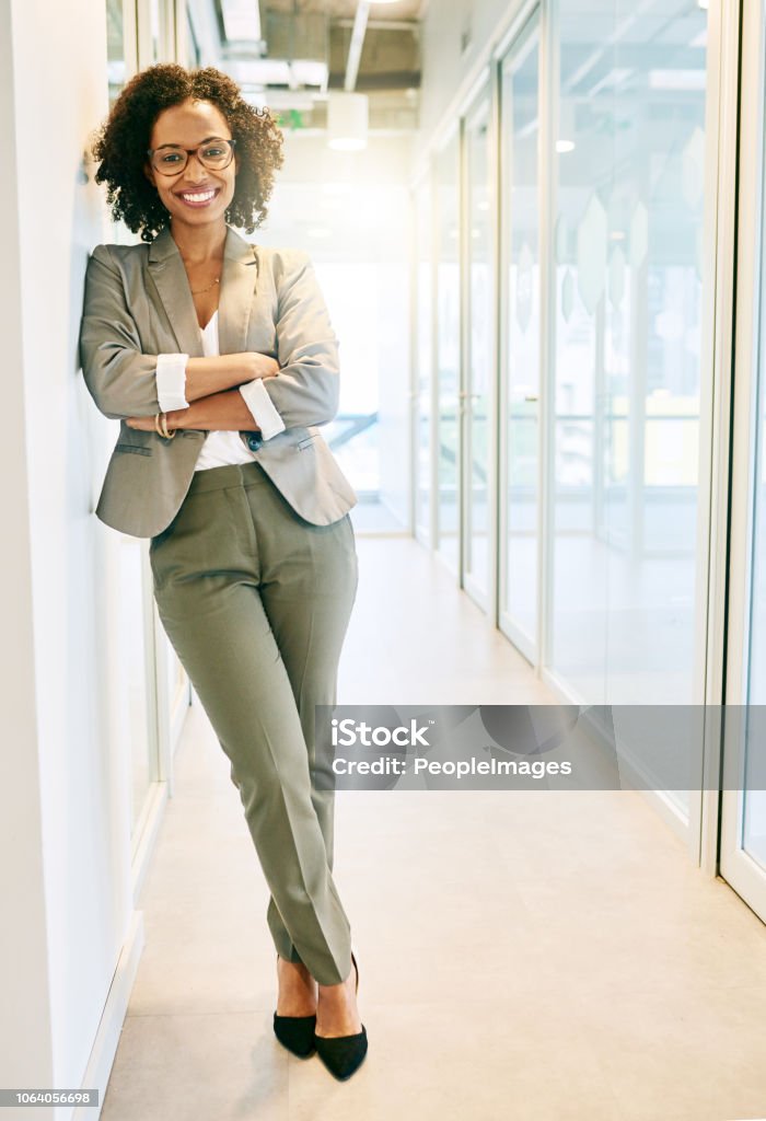 Dress for the position you want Portrait of a beautiful businesswoman in a office Businesswoman Stock Photo