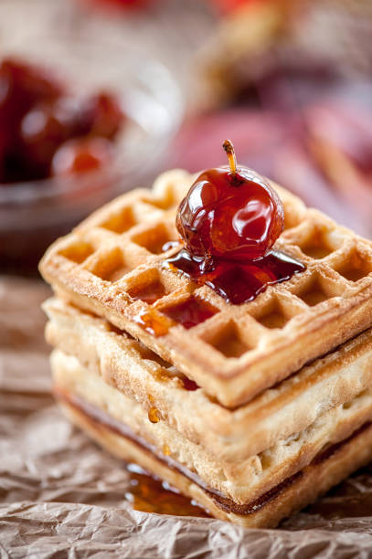 istock Homemade waffles with Apple jam on a wooden table. Close up. Copy space 1064056744