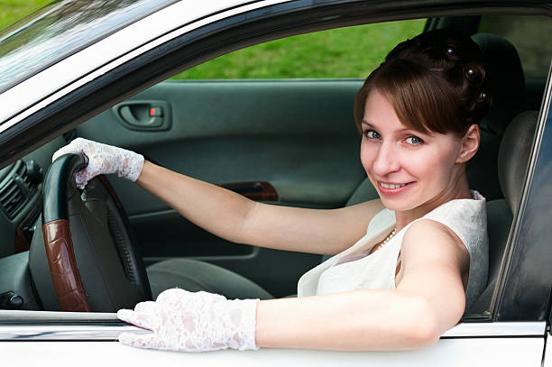 istock Woman white gloved sitting in car as a driver 106405718
