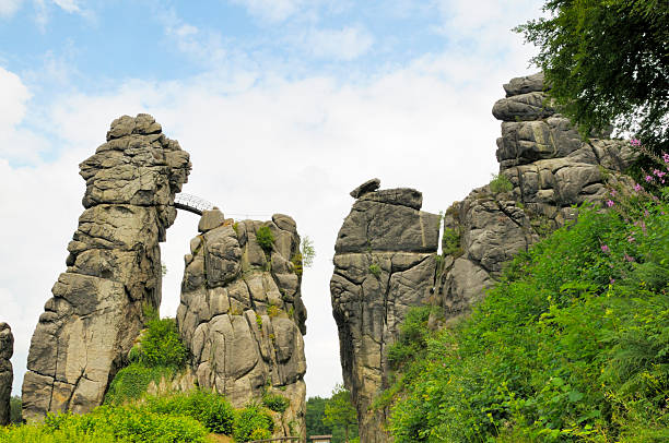 Externsteine Externsteine near Detmold Germany is a Sandstone Rockformation whose withered shapes have talked to the Mystic sides of Man ever since the Stone Ages...The Rocks have been the Scenery for Cultic Rites through the Ages. detmold stock pictures, royalty-free photos & images