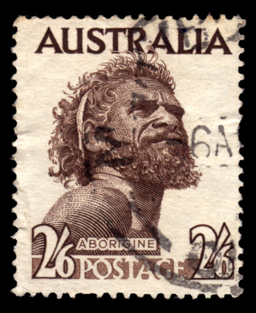 An Australian postage stamp featuring a portrait of Gwoya Tjungurrayi, an Australian Aboriginal man of the Warlpiri and Anmatyerr peoples, 1950.