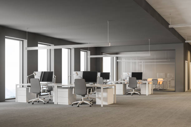 istock Gray office workplace and conference room in back 1064061636