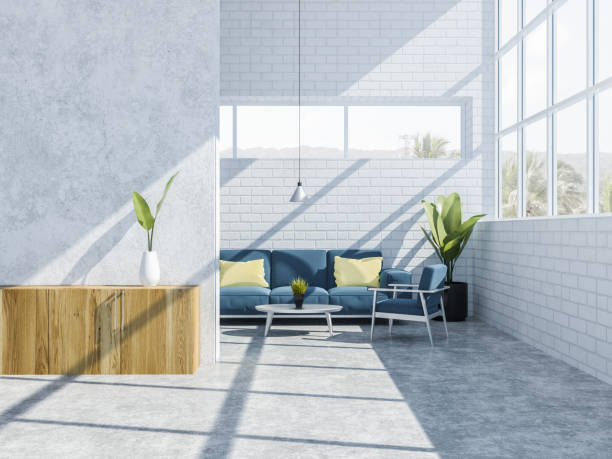 istock White brick living room interior, couch 1064061920