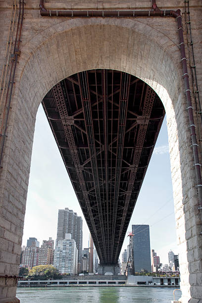 Queensboro Bridge A view of Queensboro from below roosevelt island stock pictures, royalty-free photos & images
