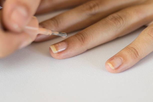 istock young girl painting her nails 1064068478