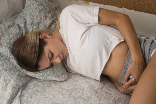 istock young girl in bed with pain 1064068874