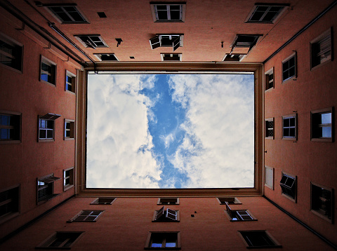 Look up the sky from the bottom view of old apartment. Architecture, low angle view