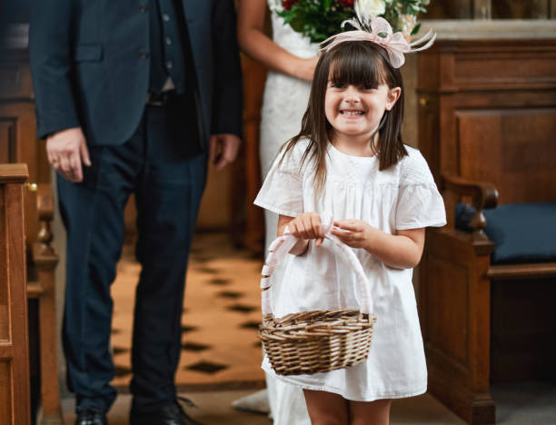 istock Flower girl walking down the aisle 1064072646