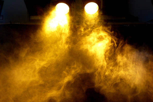istock Sepia smoke spotlight, fire stage entertainment background. 1064074984