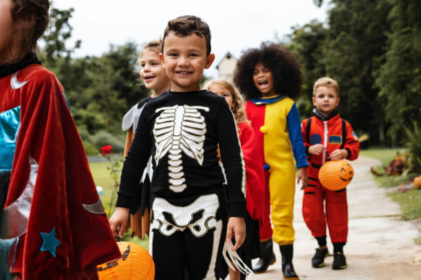 istock Young kids trick or treating during Halloween 1064075174