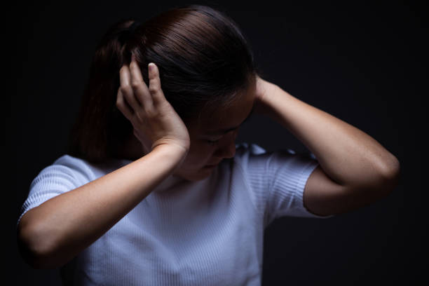 istock Woman covering her ears 1064075684
