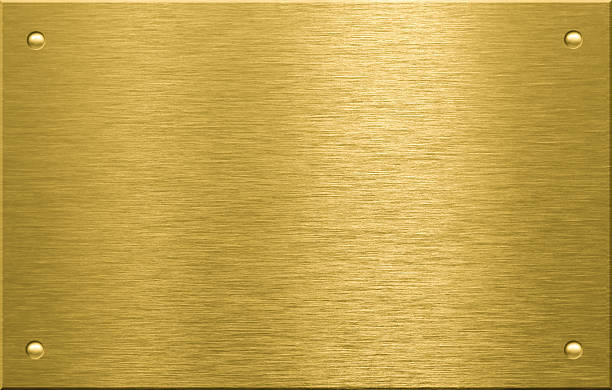 istock Brass or bronze metal plate with four rivets 106407902
