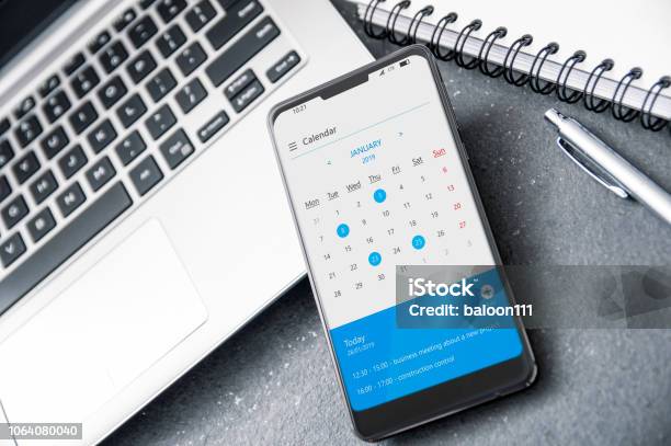 Modern Smartphone With Notch And Calendar Application For 2019 Year On Screen Stock Photo - Download Image Now