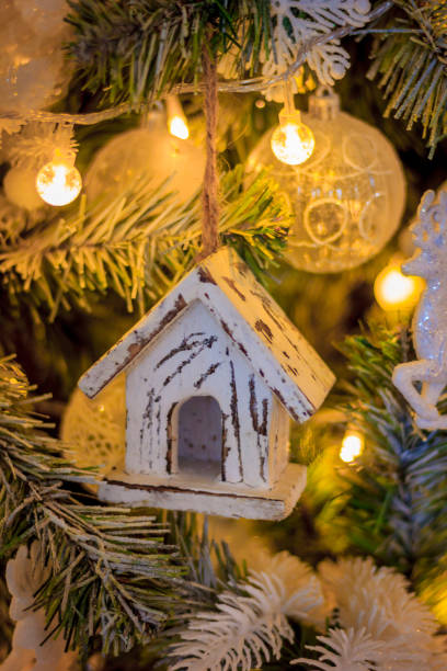 istock Closeup of red bauble hanging from a decorated Christmas tree. Retro filter effect. 1064080548