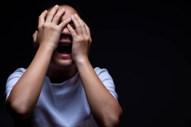 istock Woman covering her eyes and screaming 1064080610