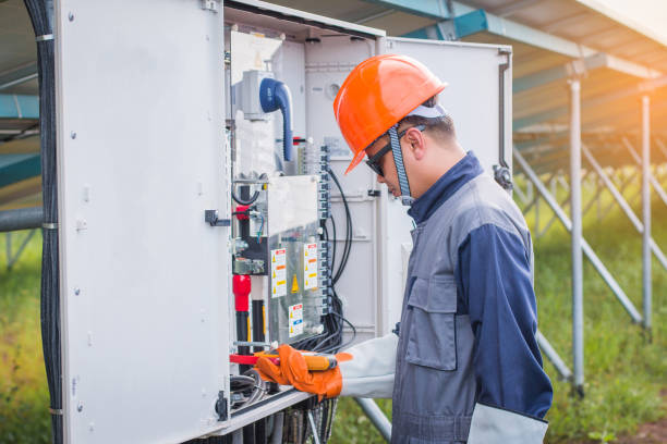istock operation and maintenance in solar power plant ; engineering team working on checking and maintenance in solar power plant 1064082566