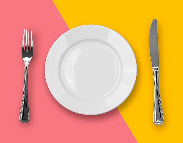 istock Knife, plate and fork on colorful background 106408577
