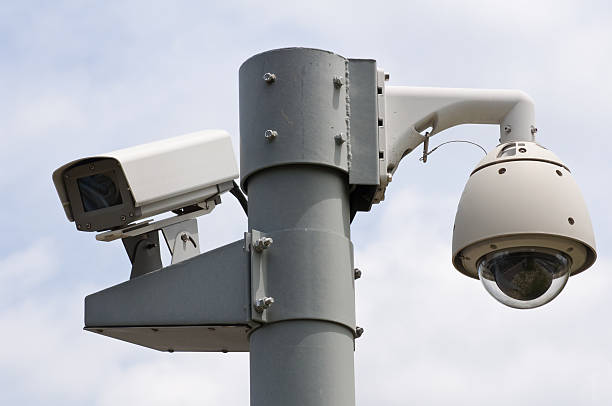 istock Surveillance cameras on a post on the street 106408711