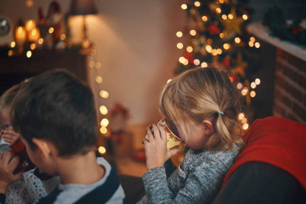 istock Cute Little Kids Drinking Hot Chocolat for Christmas 1064091634