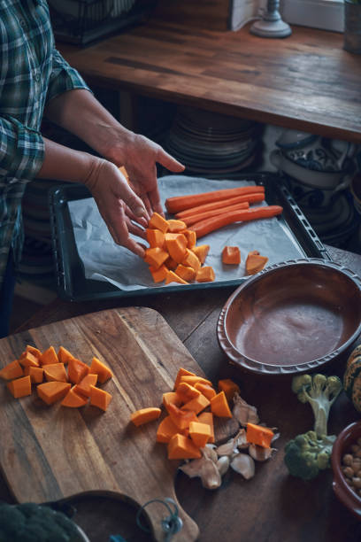 istock Preparing Pumpkin Stew with Chickpeas, Celery and Lentils 1064091700