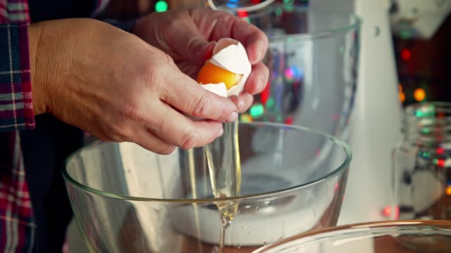 Preparing Creamy Eggnog with Cinnamon for Christmas