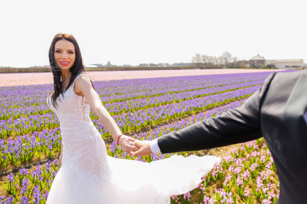 istock wedding couple posing in field 1064098276