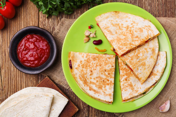 istock Quesadilla with chicken, served with guacamole or salsa sauce. 1064105758