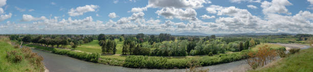 manawatu river flowing through lush countryside Manawatu river flowing through lush countryside in Palmerston North, New Zealand manawatu stock pictures, royalty-free photos & images