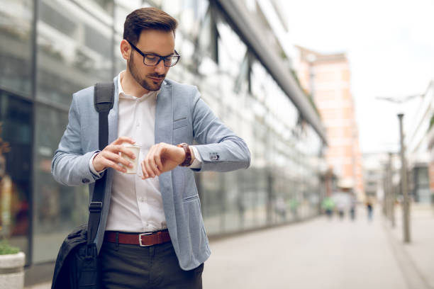 istock Businessman checking the time on his wristwatch 1064106456