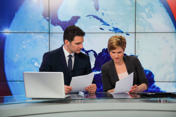 istock Journalists preparing in a tv news studio 1064110438