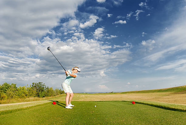 istock Young woman playing golf 106411107