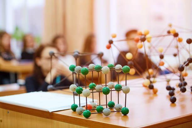 istock School children in a science class with a molecular model. Background image with soft focus. Education concept 1064112142