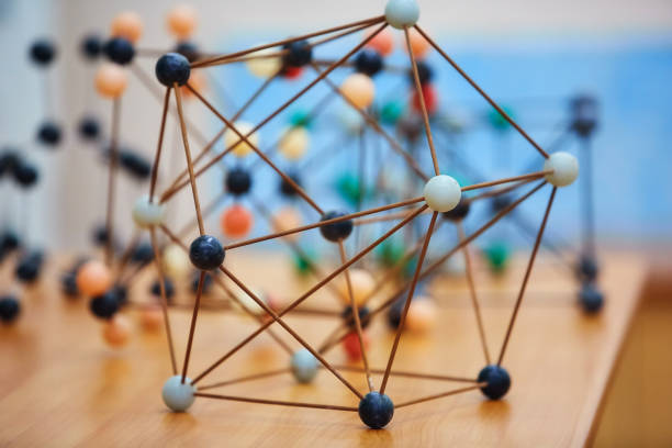 Plastic molecular educational model. On the background of the school board.