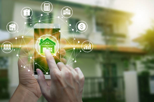 istock Hand use smartphone with property investment icons 1064115802