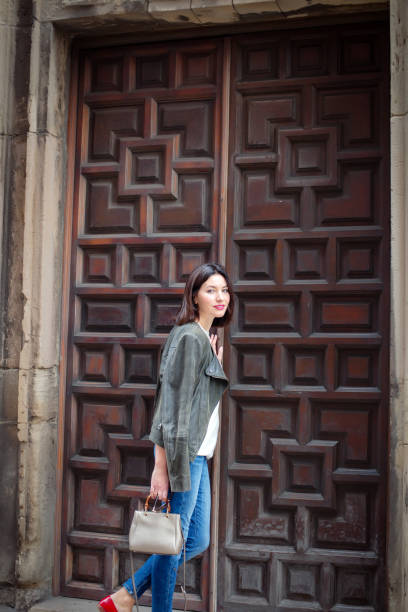 istock Woman opening door 1064118580