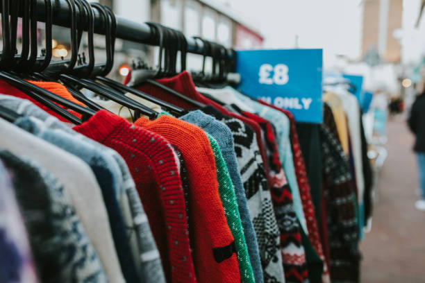 istock Clothes rack from a vintage shop with jerseys and coats. 1064119950