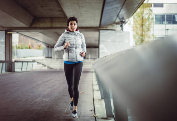 istock Female Athlete Running in an Urban Environment 1064121472