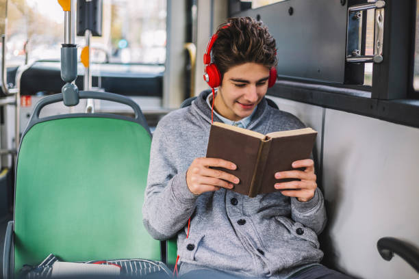 istock Teenage smileing unitil reading a book 1064122130